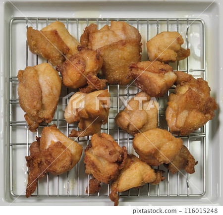 Fried chicken on a net Fried chicken on a net 116015248