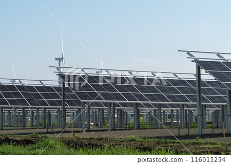 Solar panels and windmills shining in the summer sky Solar panels and windmills shining in the summer sky 116015254