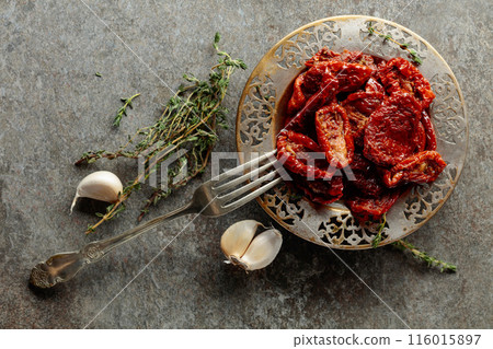 Sun-dried tomatoes in olive oil. 116015897