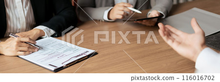 Male candidate job interviewing and answering question about curriculum vitae with HR manager woman Male candidate job interviewing and answering question about curriculum vitae with HR manager woman 116016702