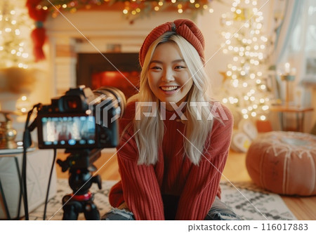 Woman vlogger. Social video blog of young girl. Media online asian influencer. Cheerful friendly attractive blonde female portrait in room 116017883