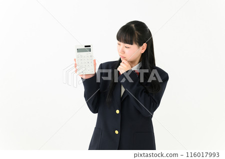 High school girl with a calculator worries 116017993