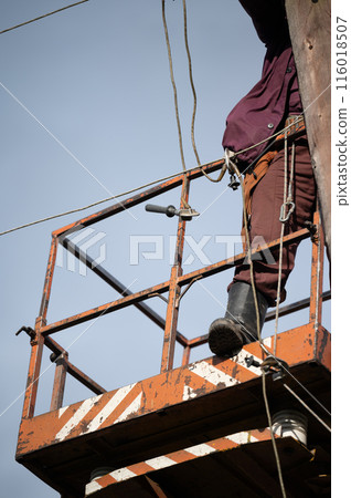 electrical pole maintenance and repair using a hydraulically powered bucket boom lift. 116018507
