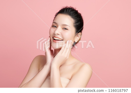 Beautiful young asian woman with clean fresh skin on pink background, Face care, Facial treatment, Cosmetology, beauty and spa, Asian women portrait. Beautiful young asian woman with clean fresh skin on pink background, Face care, Facial treatment, Cosmetology, beauty and spa, Asian women portrait. 116018797
