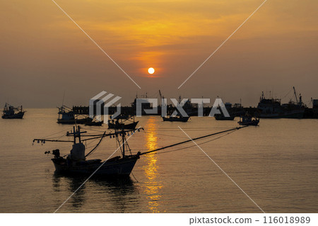 Fishing Wood boat on peaceful calm relaxing on the water and dramatic clouds at Sunset 116018989