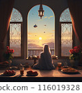 Muslim woman in hijab (Muslim scraft) sitting near the window 116019328