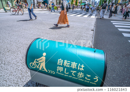 Tokyo cityscape in Japan: Please push your bicycle while walking... A horizontal warning sign has appeared Tokyo cityscape in Japan: Please push your bicycle while walking... A horizontal warning sign has appeared 116021843