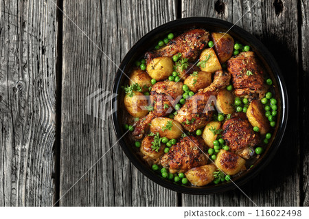 Chicken Vesuvio in a baking dish, top view 116022498