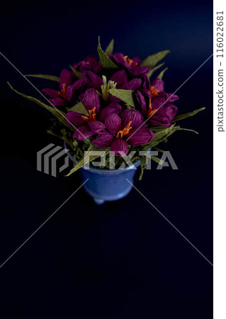 paper flowers in a blue vase on a black background paper flowers in a blue vase on a black background 116022681