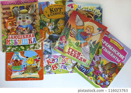 Children's books in colorful covers on a shelf in a kindergarten or bookstore 116023763