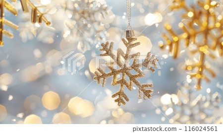 Golden snowflake ornaments hanging against a dreamy Christmas background, adorned with soft bokeh lights creating a warm, festive atmosphere. The blurred backdrop enhances the sparkle and magic scene Golden snowflake ornaments hanging against a dreamy Christmas background, adorned with soft bokeh lights creating a warm, festive atmosphere. The blurred backdrop enhances the sparkle and magic scene 116024561