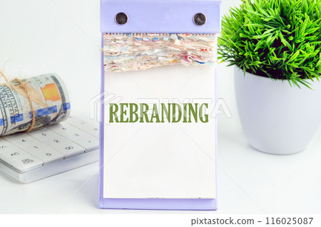 Business and rebrand concept. Copy space. REBRANDING symbol on a desktop calendar on a white background 116025087