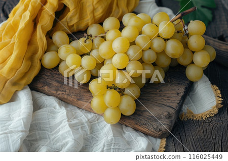 Ripe yellow grapes on a wooden background. Rustic style food photography Ripe yellow grapes on a wooden background. Rustic style food photography 116025449