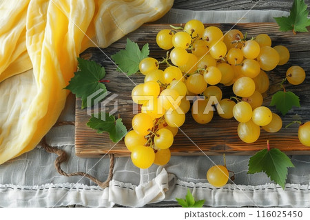 Ripe yellow grapes on a wooden background. Rustic style food photography 116025450