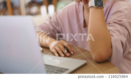 Female entrepreneur reading data to thinking about new startup project and writing idea in paper 116025964