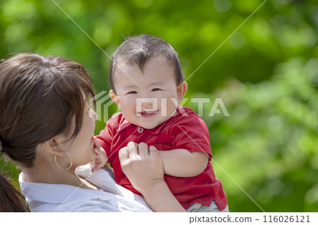 Mother with toddler playing in the park Mother with toddler playing in the park 116026121