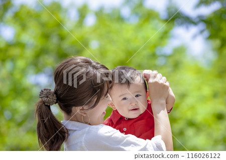Mother with toddler playing in the park Mother with toddler playing in the park 116026122