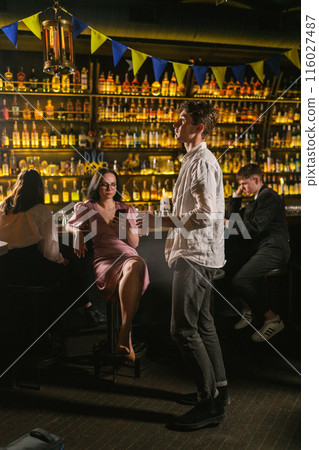 Young guy feels lonely among guests in favorite pub 116027487