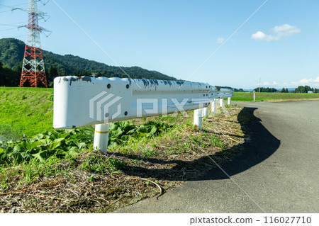 Sunlit guardrail on a rural road Sunlit guardrail on a rural road 116027710