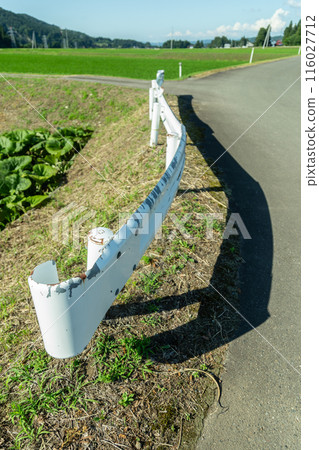Sunlit guardrail on a rural road Sunlit guardrail on a rural road 116027712