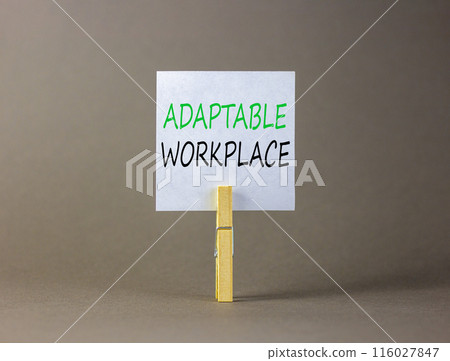Adaptable workplace symbol. Concept words Adaptable workplace on beautiful white paper on wooden clothespin. Beautiful grey background. Business Adaptable workplace concept. Copy space. Adaptable workplace symbol. Concept words Adaptable workplace on beautiful white paper on wooden clothespin. Beautiful grey background. Business Adaptable workplace concept. Copy space. 116027847