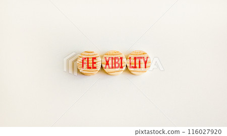 Flexibility symbol. Concept word Flexibility on beautiful wooden circles. Beautiful white background. Business flexibility concept. Copy space. Flexibility symbol. Concept word Flexibility on beautiful wooden circles. Beautiful white background. Business flexibility concept. Copy space. 116027920