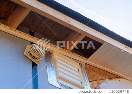 Installed along roofline of house, vinyl white uPVC soffit board below facia roof. Installed along roofline of house, vinyl white uPVC soffit board below facia roof. 116029748