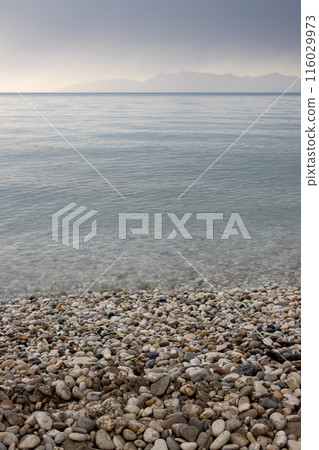 Calm sea and island Ereikousa, Greece 116029973