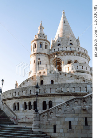 Beautiful castle on a spring day. Blue sky, warm rays of the sun 116030495