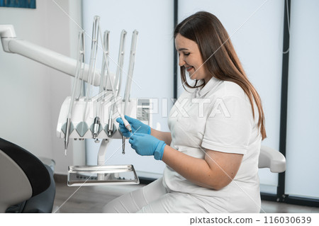 With a smile on her face, the doctor strives to relax and relieve fear in her patients, creating an atmosphere of trust. Her smile is not only a professional endurance, but also a medicine that makes With a smile on her face, the doctor strives to relax and relieve fear in her patients, creating an atmosphere of trust. Her smile is not only a professional endurance, but also a medicine that makes 116030639