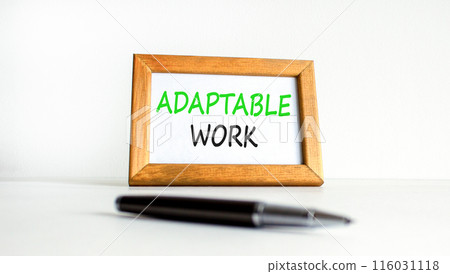 Adaptable work symbol. Concept words Adaptable work on beautiful wooden picture frame. Beautiful white paper background. Black pen. Business Adaptable work concept. Copy space. Adaptable work symbol. Concept words Adaptable work on beautiful wooden picture frame. Beautiful white paper background. Black pen. Business Adaptable work concept. Copy space. 116031118