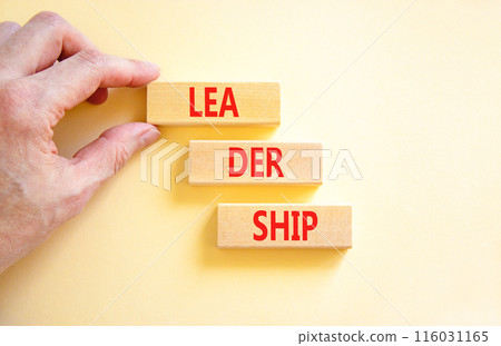 Leadership symbol. Concept word Leadership on beautiful wooden blocks. Businessman hand. Beautiful white background. Business leadership concept. Copy space. 116031165