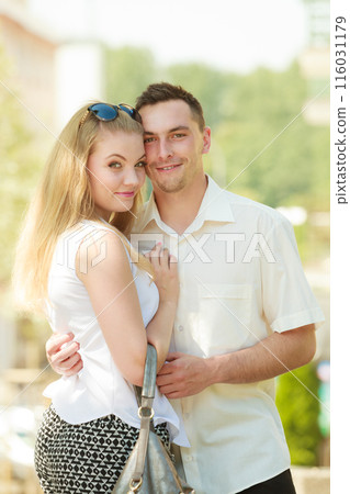 Happy couple walking in city enjoying romance 116031179