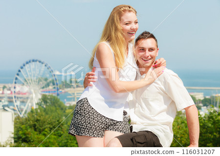 Happy romantic couple with city in background 116031207