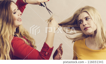 Woman with scissors ready to hair cutting Woman with scissors ready to hair cutting 116031341