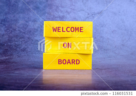 WELCOME ON BOARD on wooden blocks on an abstract bright background WELCOME ON BOARD on wooden blocks on an abstract bright background 116031531