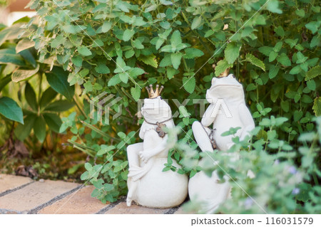 Gardening: Mint leaves and frog ornaments 116031579