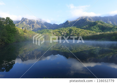 Kagamiike Pond on the Togakushi Plateau, with the Togakushi mountain range reflected on its surface Kagamiike Pond on the Togakushi Plateau, with the Togakushi mountain range reflected on its surface 116032779