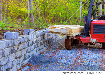 Building materials are being delivered by contractor using forklift Building materials are being delivered by contractor using forklift 116033155