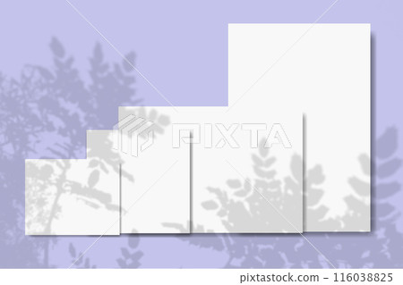 Several horizontal and vertical sheets of white textured paper against a violet wall background. Mockup. 116038825