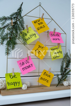 Action board new year's resolutions on colorful sticky notes. Making promises for new year, setting goals. Dream year Action board new year's resolutions on colorful sticky notes. Making promises for new year, setting goals. Dream year 116039773
