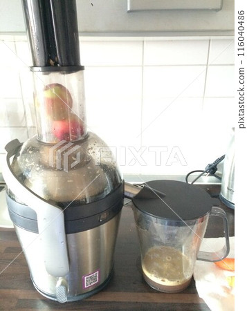 Whole apple juice made with a juicer Whole apple juice made with a juicer 116040486