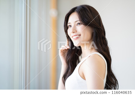 Young woman with long black hair (beauty image, white sleeveless, window, natural light) 116040635