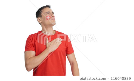 Man listening to the Switzerland national anthem with solemnity Man listening to the Switzerland national anthem with solemnity 116040889