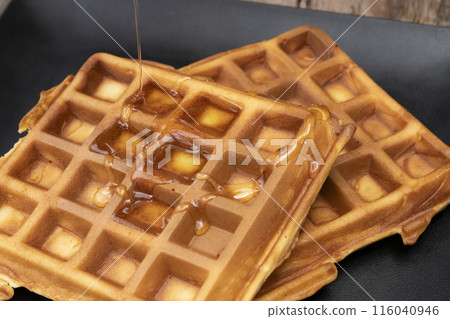 Waffles, making Western sweets, American waffles, pouring syrup Waffles, making Western sweets, American waffles, pouring syrup 116040946