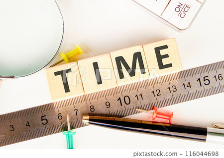 BUSINESS concept. TIME word letters on on wooden cubes laid out along the measuring ruler BUSINESS concept. TIME word letters on on wooden cubes laid out along the measuring ruler 116044698