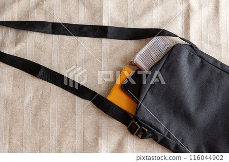 Stationery and smartphone in a shoulder bag 116044902