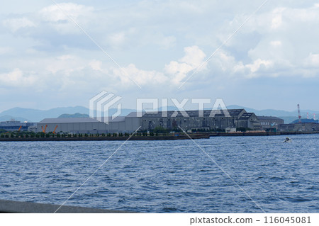 Island and clouds seen from the sea 116045081
