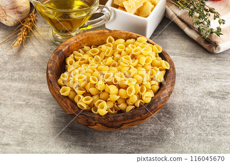 Italian cuisine - dry conchiglie pasta Italian cuisine - dry conchiglie pasta 116045670