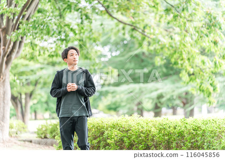 Asian man exercising, walking, running, training in the park 116045856